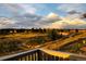 Enjoy the view from this balcony of green space, walking trail, and distant bridge at 6805 Zebra Grass Ln, Parker, CO 80138