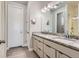 Bathroom features a granite countertop, dual sinks, and modern fixtures at 6805 Zebra Grass Ln, Parker, CO 80138