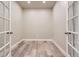 Versatile office space with hardwood floors and elegant French doors at 6805 Zebra Grass Ln, Parker, CO 80138