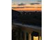 Beautiful sunset view from the balcony, with distant mountains and a peaceful neighborhood ambiance at 6805 Zebra Grass Ln, Parker, CO 80138