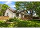 Charming home featuring a wood deck, fenced yard, mature trees and attractive landscaping at 9174 Lark Sparrow Pl, Highlands Ranch, CO 80126