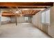 Spacious unfinished basement with concrete floors and partially finished walls, offering potential at 9174 Lark Sparrow Pl, Highlands Ranch, CO 80126