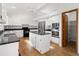 Bright kitchen boasts granite countertops, stainless steel appliances and a central island at 9174 Lark Sparrow Pl, Highlands Ranch, CO 80126