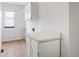 Clean laundry room with white cabinets and counter space at 9174 Lark Sparrow Pl, Highlands Ranch, CO 80126