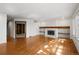 Spacious living room featuring fireplace, hardwood floors, and natural light at 9174 Lark Sparrow Pl, Highlands Ranch, CO 80126