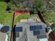 Aerial view of a home featuring solar panels on the roof, a backyard deck, and a trampoline at 291 W Sycamore Ln, Louisville, CO 80027