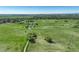 Scenic aerial view of a lush green park with walking trails and a tranquil pond surrounded by trees at 291 W Sycamore Ln, Louisville, CO 80027
