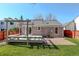 Backyard featuring a deck, pergola, and a gravel area, perfect for outdoor entertaining at 291 W Sycamore Ln, Louisville, CO 80027