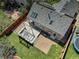 Aerial view of a backyard with a wooden deck, pergola, skylights, and privacy fence at 291 W Sycamore Ln, Louisville, CO 80027