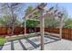 Cozy backyard deck with a pergola, built-in seating, and a dining table, ideal for relaxation at 291 W Sycamore Ln, Louisville, CO 80027