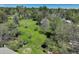 Lush backyard view with mature trees, a charming fence, and a glimpse of outdoor living spaces at 291 W Sycamore Ln, Louisville, CO 80027