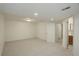 Finished basement area leading to bathroom with neutral walls and flooring at 291 W Sycamore Ln, Louisville, CO 80027