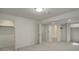 Spacious finished basement area with neutral flooring and an adjoining bathroom at 291 W Sycamore Ln, Louisville, CO 80027