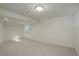 Finished basement area with a large window and neutral walls and flooring at 291 W Sycamore Ln, Louisville, CO 80027