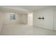 Large finished basement with bright neutral walls and flooring with a window at 291 W Sycamore Ln, Louisville, CO 80027