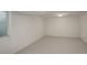 Finished basement area with a large window, neutral walls and flooring at 291 W Sycamore Ln, Louisville, CO 80027