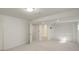 Large finished basement area leading to bathroom with neutral walls and flooring at 291 W Sycamore Ln, Louisville, CO 80027
