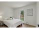 Bright bedroom with hardwood floors and backyard view at 291 W Sycamore Ln, Louisville, CO 80027