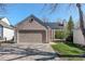 Charming home featuring a two-car garage, solar panels, and a well-maintained front yard at 291 W Sycamore Ln, Louisville, CO 80027