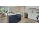 Kitchen with island opens to living area at 291 W Sycamore Ln, Louisville, CO 80027