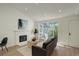 Bright living room with fireplace and access to outdoor at 291 W Sycamore Ln, Louisville, CO 80027