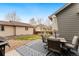 Cozy back patio with outdoor seating, rug, and umbrella provides a relaxing space for outdoor enjoyment at 11022 Newark St, Commerce City, CO 80640