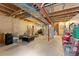 Unfinished basement area with exposed ceiling, concrete walls, and visible utilities for flexible use and storage at 11022 Newark St, Commerce City, CO 80640