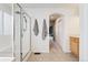 Bathroom featuring a walk-in shower, tiled floors, vanity, and access to the main bedroom at 11022 Newark St, Commerce City, CO 80640