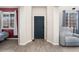Bright entryway with wood-look floors, with views into living spaces at 11022 Newark St, Commerce City, CO 80640