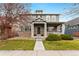 Charming two-story home with a welcoming front porch and well-manicured lawn at 11022 Newark St, Commerce City, CO 80640