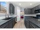 Spacious kitchen featuring granite countertops, stainless steel appliances, and ample storage space at 11022 Newark St, Commerce City, CO 80640