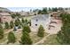 Beautiful aerial shot of house surrounded by trees and lush foliage, perfect for nature lovers at 1553 Plowman Dr, Monument, CO 80132