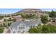 Stunning aerial view of a home nestled in a lush landscape with mountain views at 1553 Plowman Dr, Monument, CO 80132