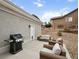 Relaxing backyard patio with outdoor seating and grill, perfect for entertaining guests at 1553 Plowman Dr, Monument, CO 80132