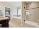 Elegant bathroom with a glass shower, a soaking tub, and tile flooring, providing a spa-like retreat at 1553 Plowman Dr, Monument, CO 80132