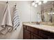 Elegant bathroom with a granite countertop, dark wood cabinets, and a shower with a glass enclosure at 1553 Plowman Dr, Monument, CO 80132