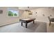 Spacious game room with a pool table and an attractive overhead light fixture at 1553 Plowman Dr, Monument, CO 80132