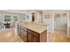 Spacious kitchen boasts granite countertops, wood cabinets, stainless appliances, and an adjacent eating area at 1553 Plowman Dr, Monument, CO 80132