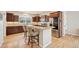 Well-equipped kitchen featuring granite countertops, dark wood cabinets, and stainless steel appliances at 1553 Plowman Dr, Monument, CO 80132