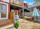 Charming backyard featuring a stone patio, seating area, and outdoor grill at 2524 Champa St # 1, Denver, CO 80205