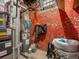 Basement features water heater and utility equipment against a brick wall at 2524 Champa St # 1, Denver, CO 80205