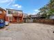 Rear exterior view of home with balconies and parking area at 2524 Champa St # 1, Denver, CO 80205