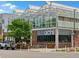 Unique greenhouse-style building with modern architectural design, lush landscaping and a stylish entrance at 2524 Champa St # 1, Denver, CO 80205