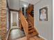 Staircase with wooden railings and modern decor elements, complemented by tile flooring at 2524 Champa St # 1, Denver, CO 80205