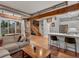 Inviting living space with staircase, exposed brick, open-concept kitchen, and cozy seating at 2524 Champa St # 1, Denver, CO 80205