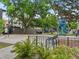 Picturesque park with basketball court and modern playground equipment surrounded by mature trees at 2524 Champa St # 1, Denver, CO 80205