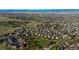 Expansive neighborhood aerial view featuring mountain backdrop at 1431 Beacon Hill Dr, Highlands Ranch, CO 80126