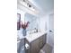 Bathroom with double sinks, a large mirror, and neutral decor and color scheme, and natural paint at 1431 Beacon Hill Dr, Highlands Ranch, CO 80126