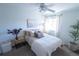 Cozy bedroom with a neutral color palette, comfortable bedding, ceiling fan, and natural light at 1431 Beacon Hill Dr, Highlands Ranch, CO 80126