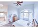 Light-filled bedroom features a large bay window, vaulted ceiling, and a cozy, neutral color palette at 1431 Beacon Hill Dr, Highlands Ranch, CO 80126